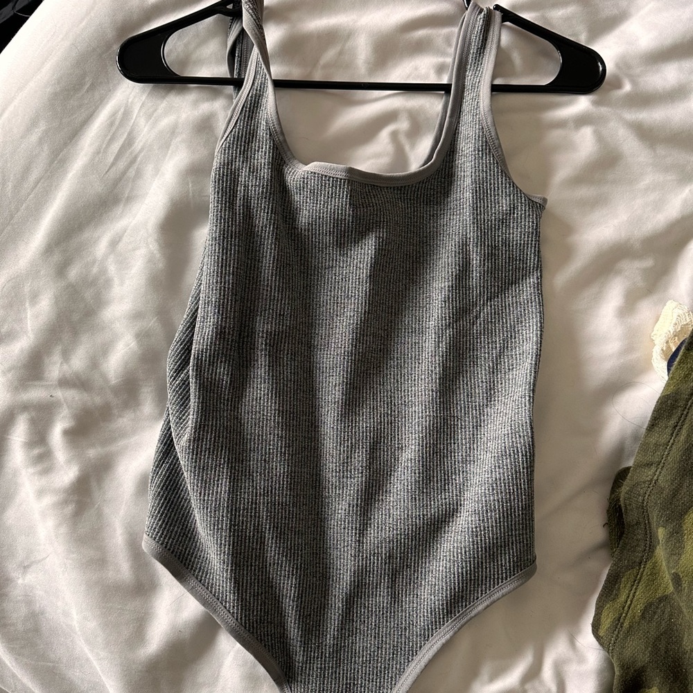 Grey body suit